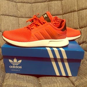 Orange Adidas tennis shoes